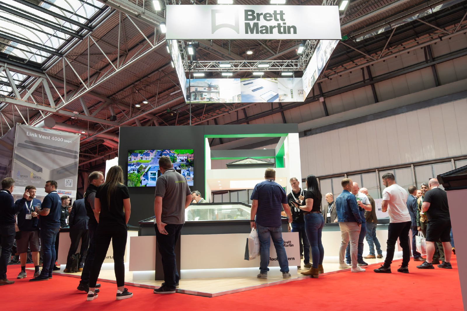 Visitors viewing Brett Martin rooflight products at FIT Show